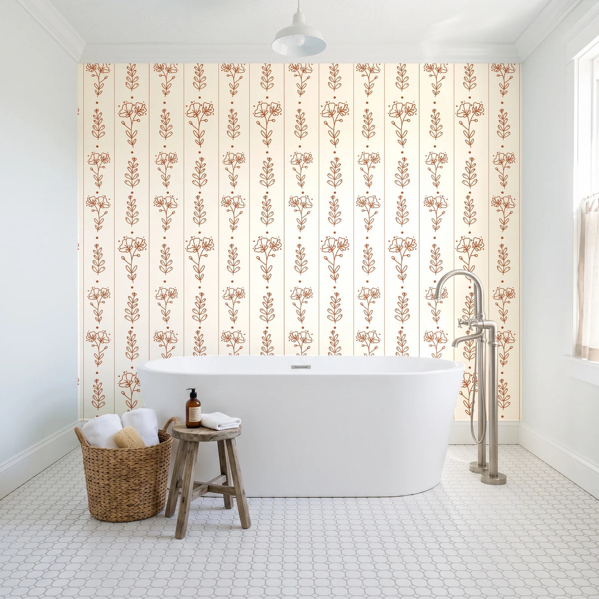 Petal & Thread Terracotta botanical stem wallpaper behind a freestanding tub in a bright coastal bathroom