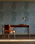 Petal Cascade Emerald spiral rosette wallpaper as a feature wall in a home study