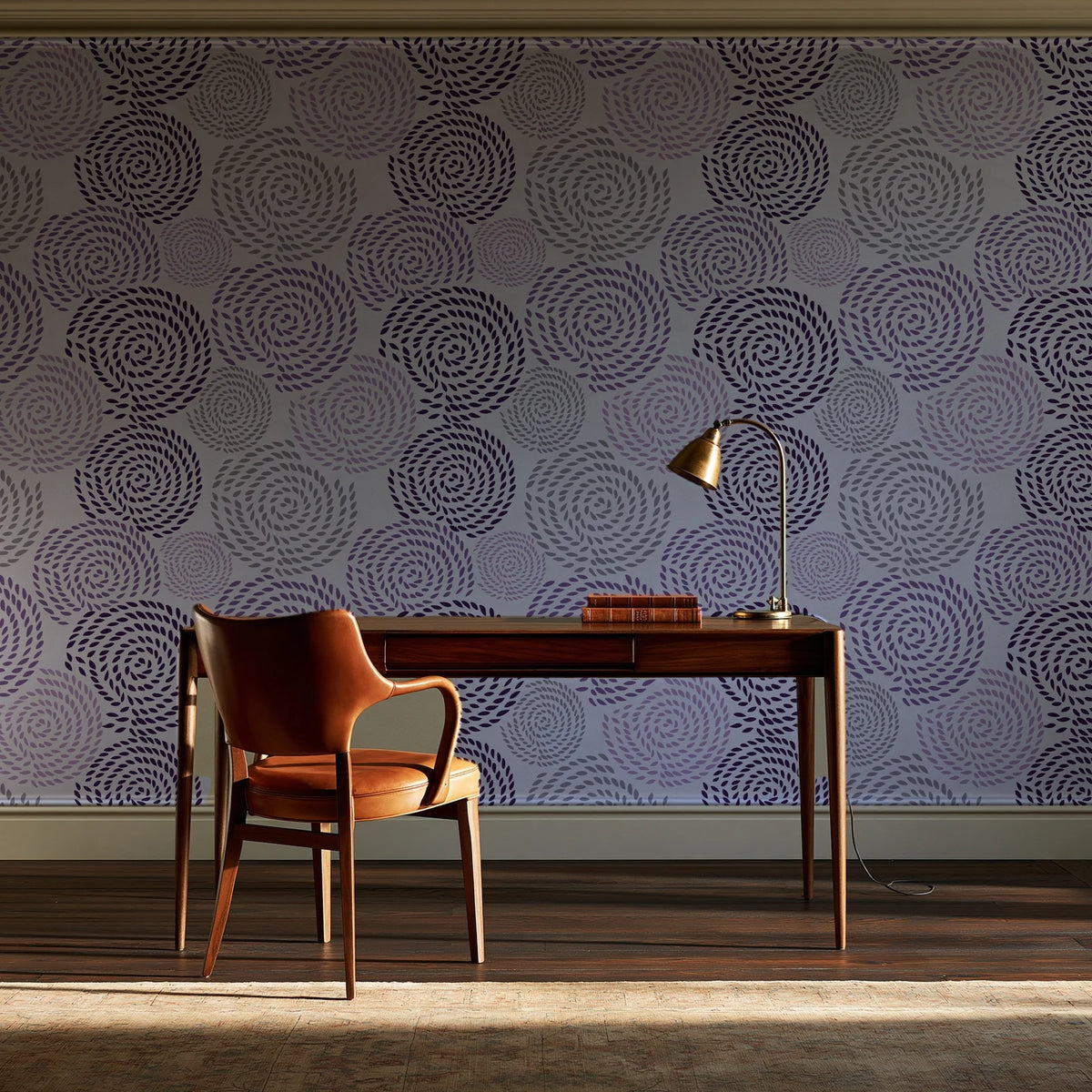 Petal Cascade Plum spiral rosette wallpaper as a feature wall in a home study