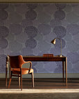 Petal Cascade Plum spiral rosette wallpaper as a feature wall in a home study