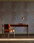 Petal Cascade Terracotta spiral rosette wallpaper as a feature wall in a home study