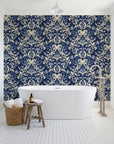 Petal Reflection Midnight floral damask wallpaper behind a freestanding tub in a bright coastal bathroom