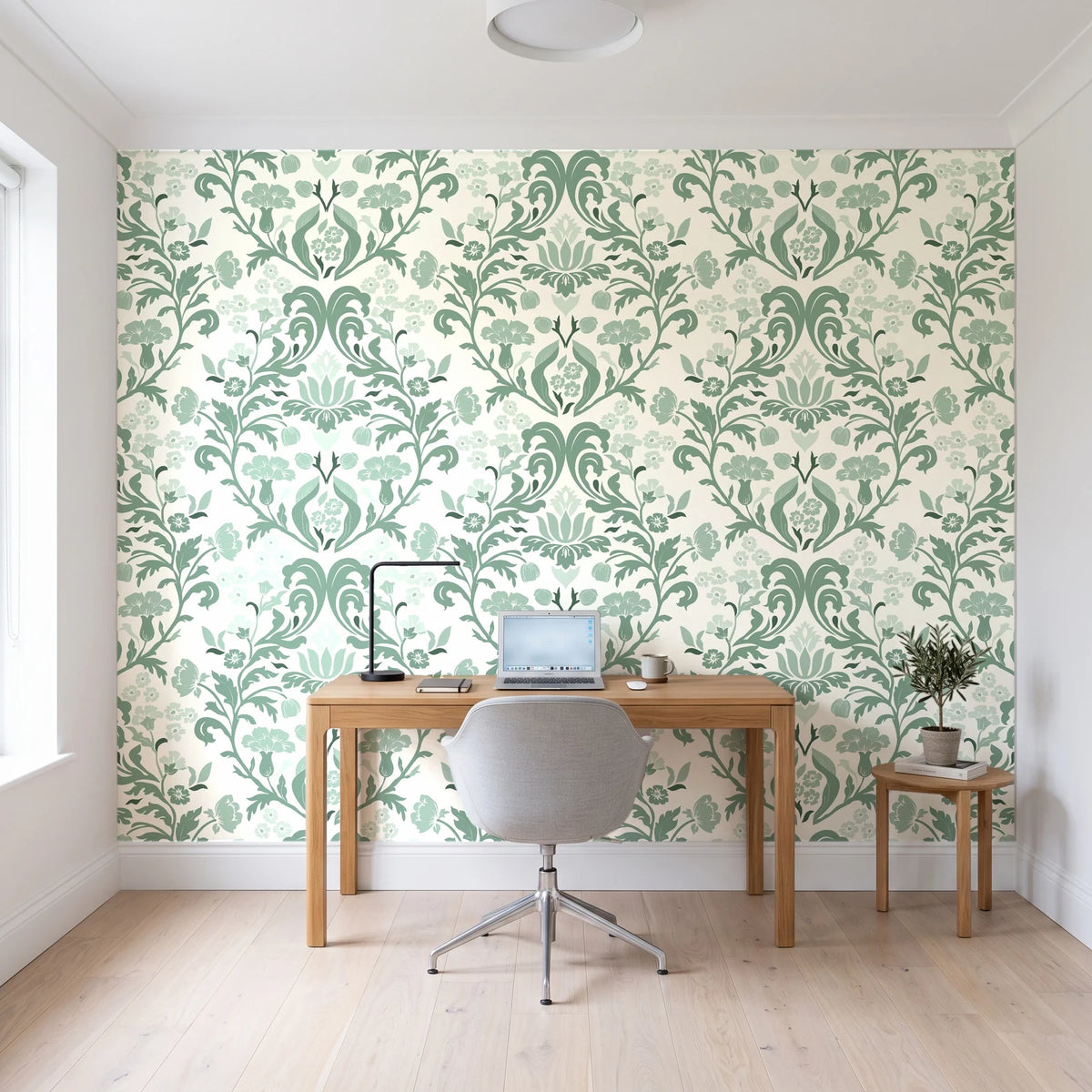 Petal Reflection Sage floral damask wallpaper behind a modern oak desk in a bright home office