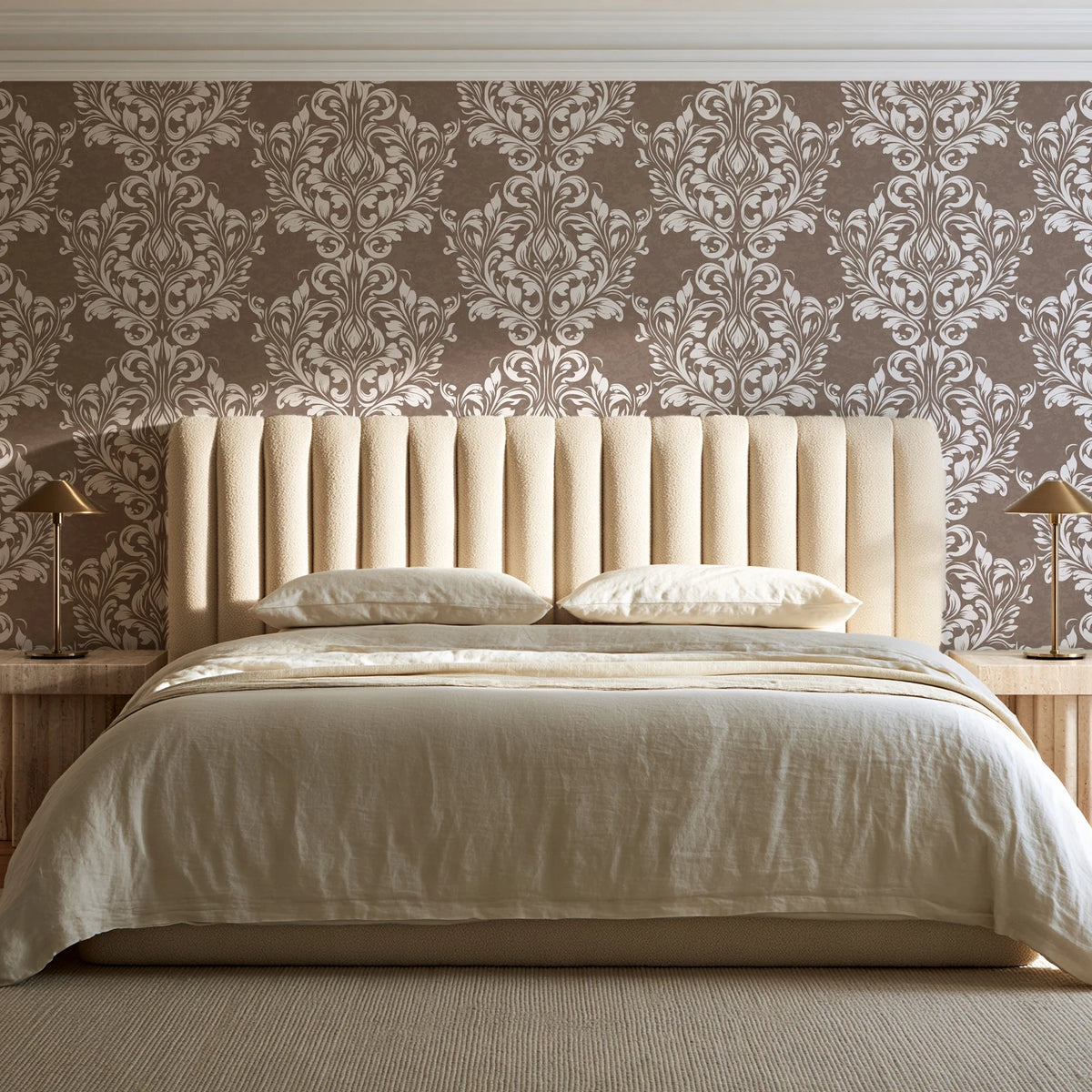 Petal Symphony Mocha baroque damask wallpaper behind a channel-tufted bed in a calm primary bedroom