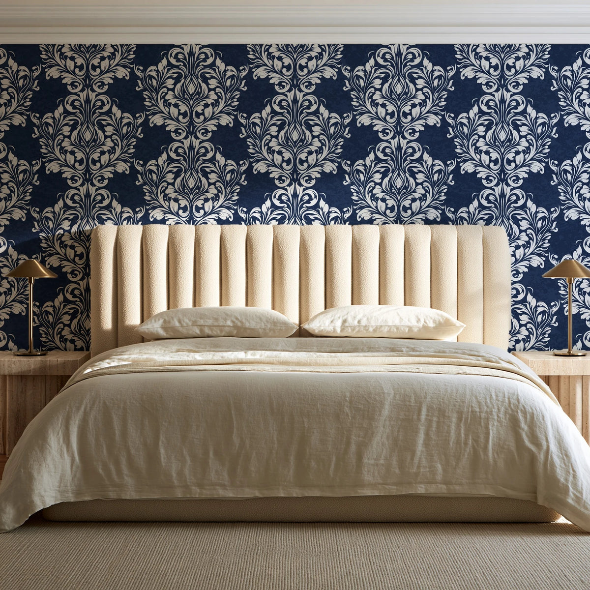 Petal Symphony Navy baroque damask wallpaper behind a channel-tufted bed in a calm primary bedroom
