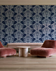 Petal Symphony Navy baroque damask wallpaper in a boutique hotel sitting area