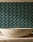 Pewter Fern Pine fern wallpaper creating ambiance in a serene spa bathroom