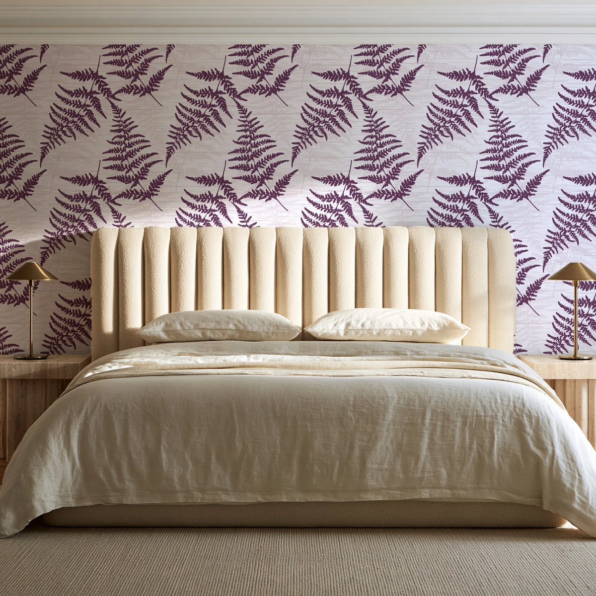 Pewter Fern Plum fern wallpaper behind a channel-tufted bed in a calm primary bedroom
