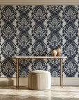 Poet's Blossom Charcoal classic damask wallpaper on the wall of a grand entry foyer
