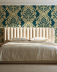 Poet's Blossom Peacock classic damask wallpaper behind a channel-tufted bed in a calm primary bedroom