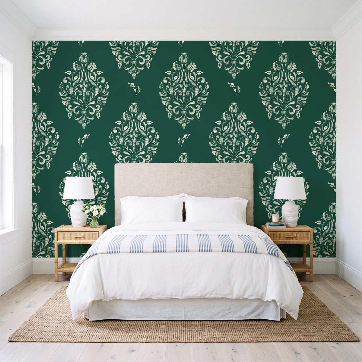 Porcelain Bouquet Emerald damask wallpaper behind a queen bed in a bright coastal bedroom