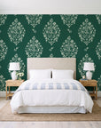 Porcelain Bouquet Emerald damask wallpaper behind a queen bed in a bright coastal bedroom