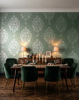 Porcelain Bouquet Sage damask wallpaper in a dark moody dining room with a candlelit table