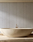 Porcelain Filigree Taupe filigree damask wallpaper creating ambiance in a serene spa bathroom