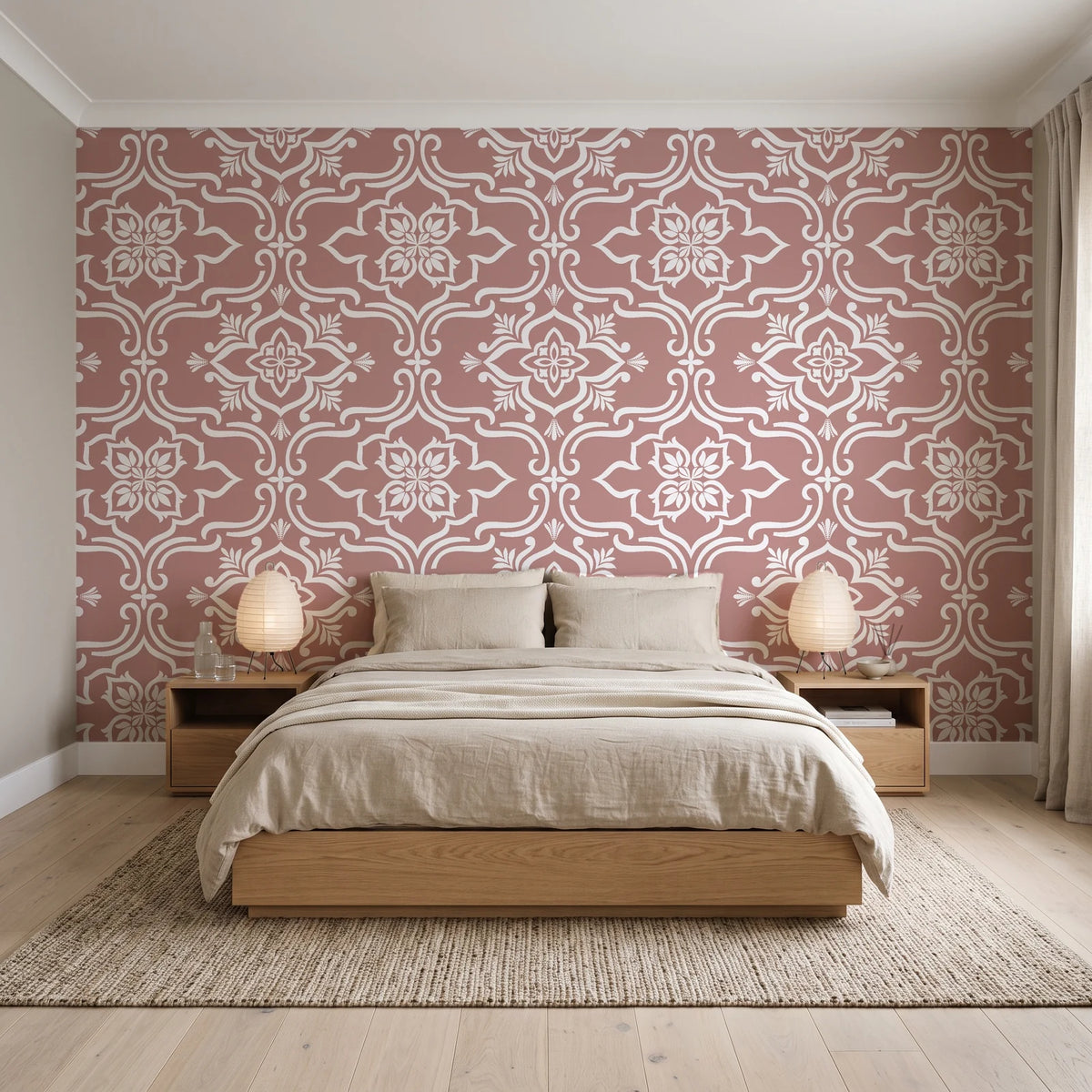 Pure Fern Fantasy Dusty Rose fern medallion wallpaper behind a low platform bed in a serene Japandi bedroom