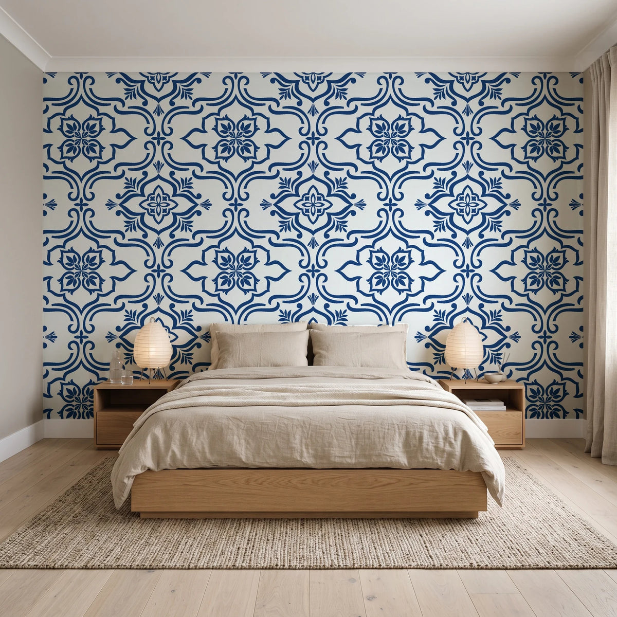 Pure Fern Fantasy Porcelain fern medallion wallpaper behind a low platform bed in a serene Japandi bedroom