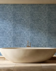 Quiet Camo Slate abstract wallpaper creating ambiance in a serene spa bathroom
