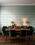 Quiet Grace Emerald minimalist arch wallpaper in a dark moody dining room with a candlelit table