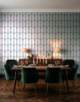 Quiet Grace Midnight minimalist arch wallpaper in a dark moody dining room with a candlelit table