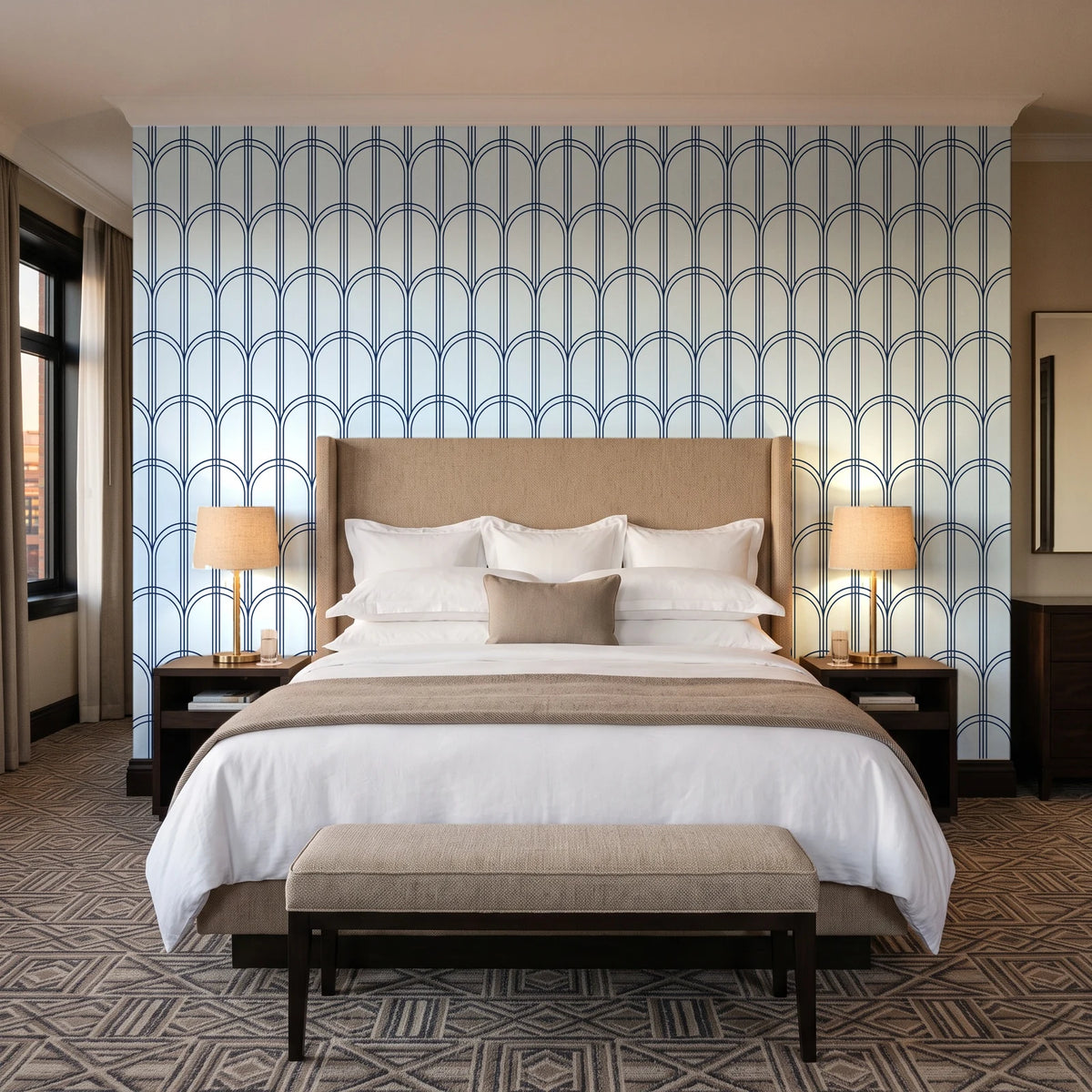 Quiet Grace Midnight minimalist arch wallpaper behind the headboard of a king bed in a contemporary hotel guest room