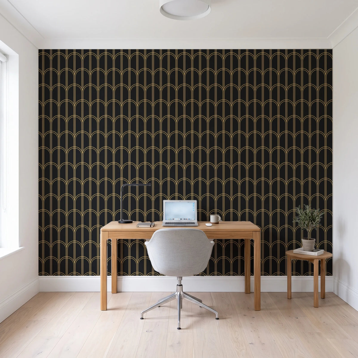 Quiet Grace Noir minimalist arch wallpaper behind a modern oak desk in a bright home office