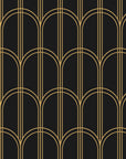 Quiet Grace Noir minimalist arch wallpaper in black and brass