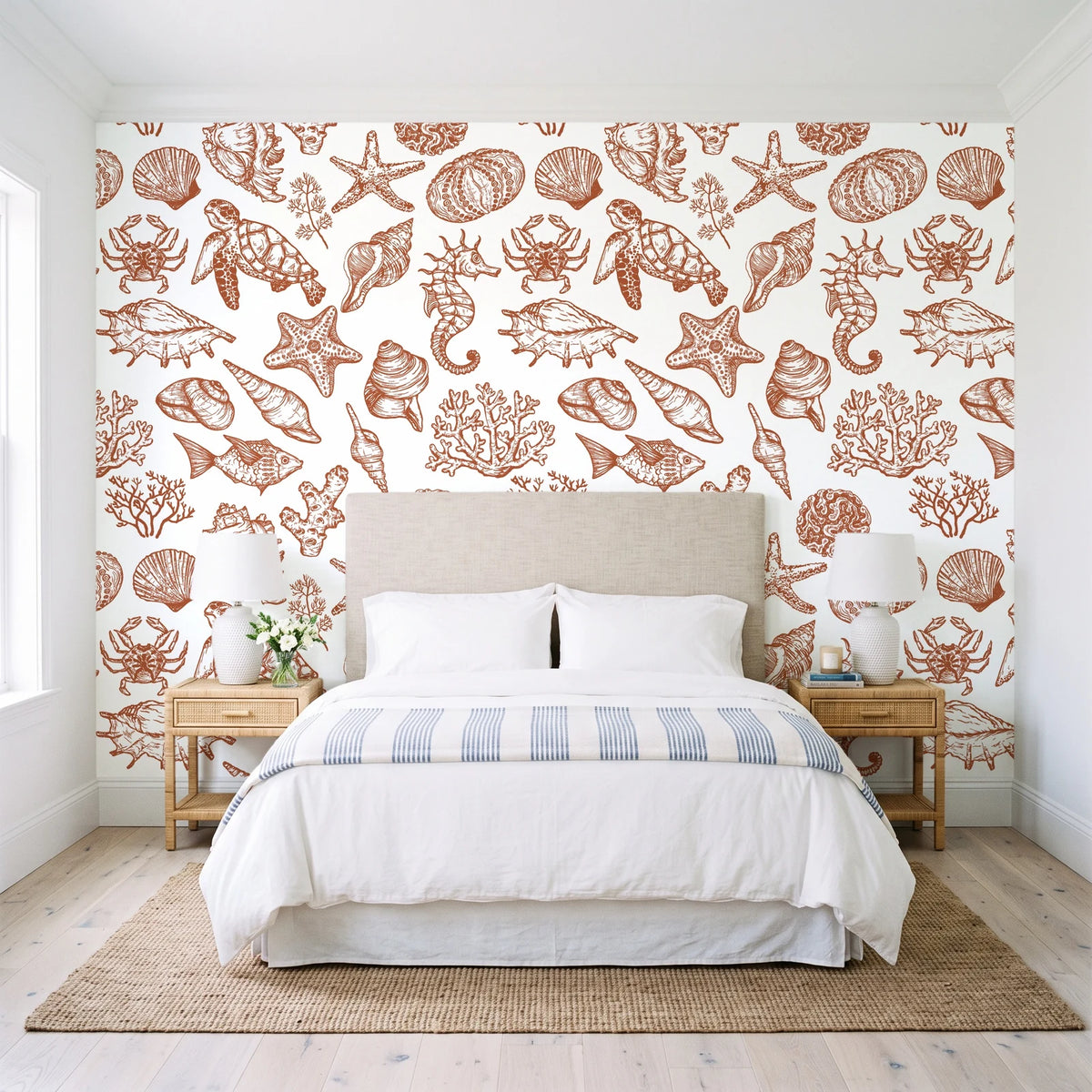 Quiet Reef Terracotta sea life wallpaper behind a queen bed in a bright coastal bedroom