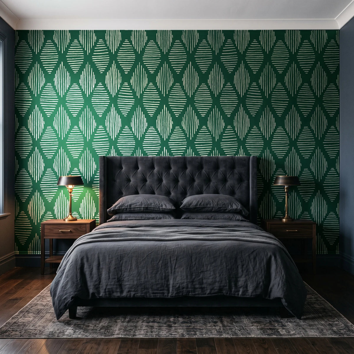Reed & Smoke Emerald geometric wallpaper behind a tufted headboard in a dark, moody bedroom