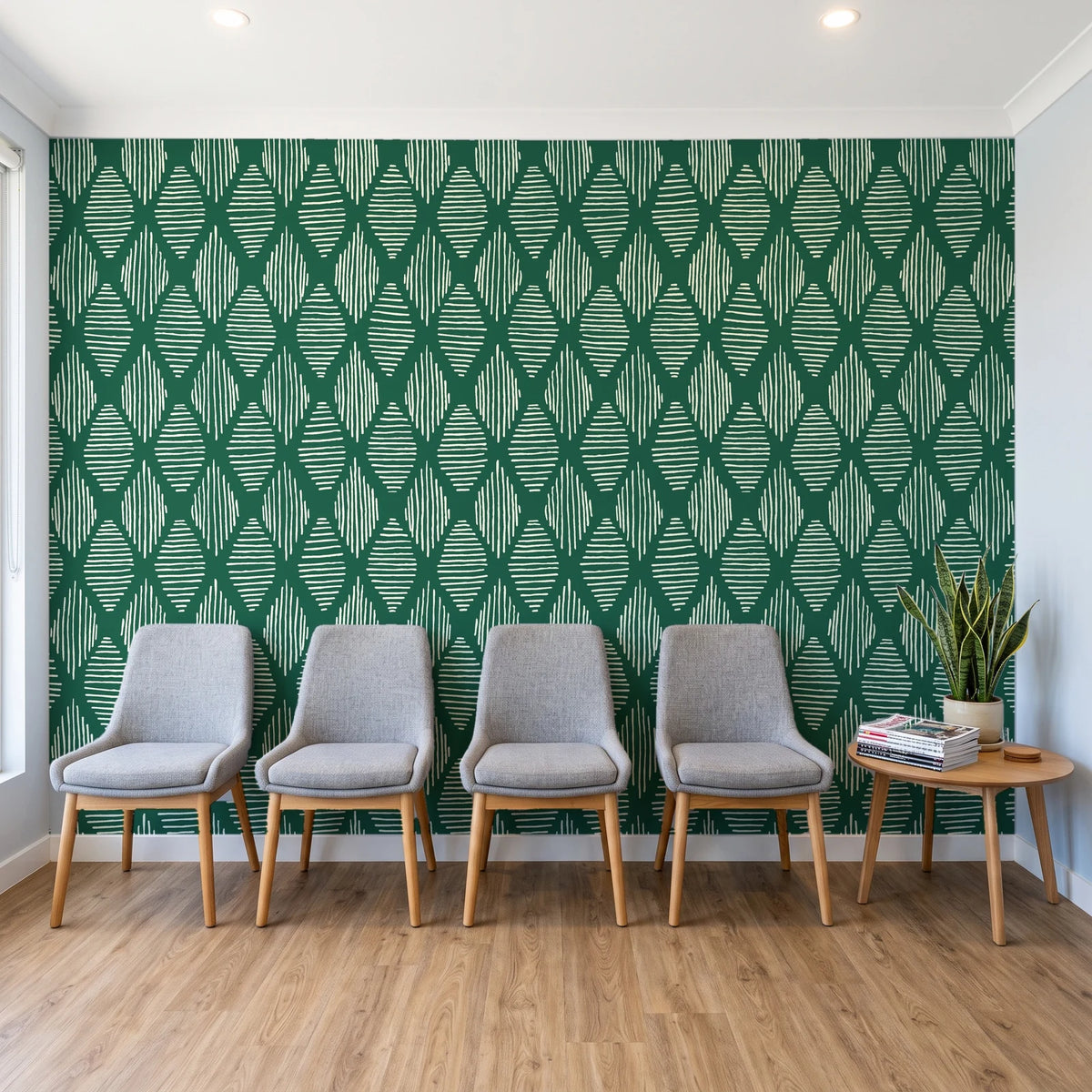 Reed & Smoke Emerald geometric wallpaper behind a row of upholstered chairs in a bright clinic waiting room
