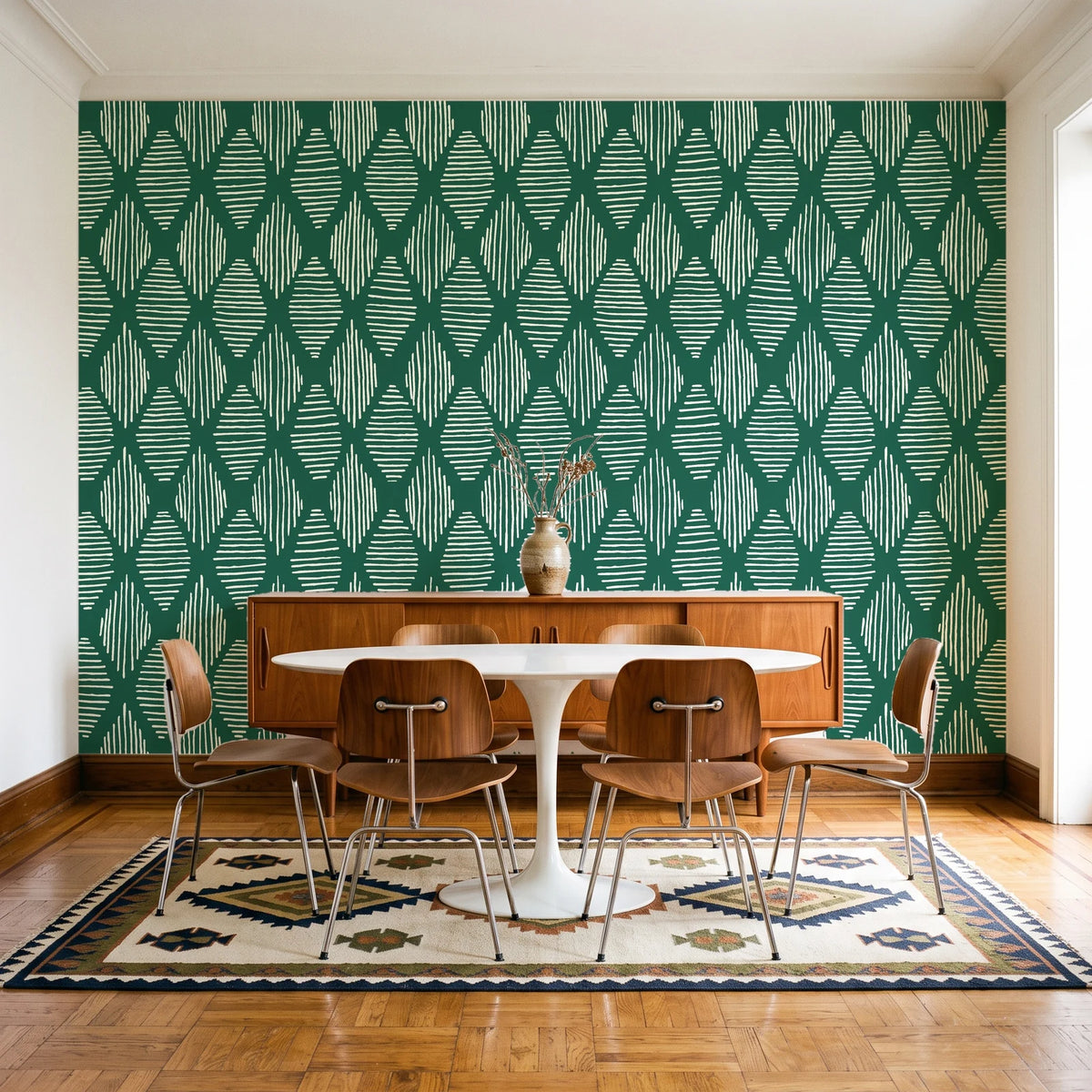 Reed & Smoke Emerald geometric wallpaper in a mid-century dining room with a teak sideboard and tulip table