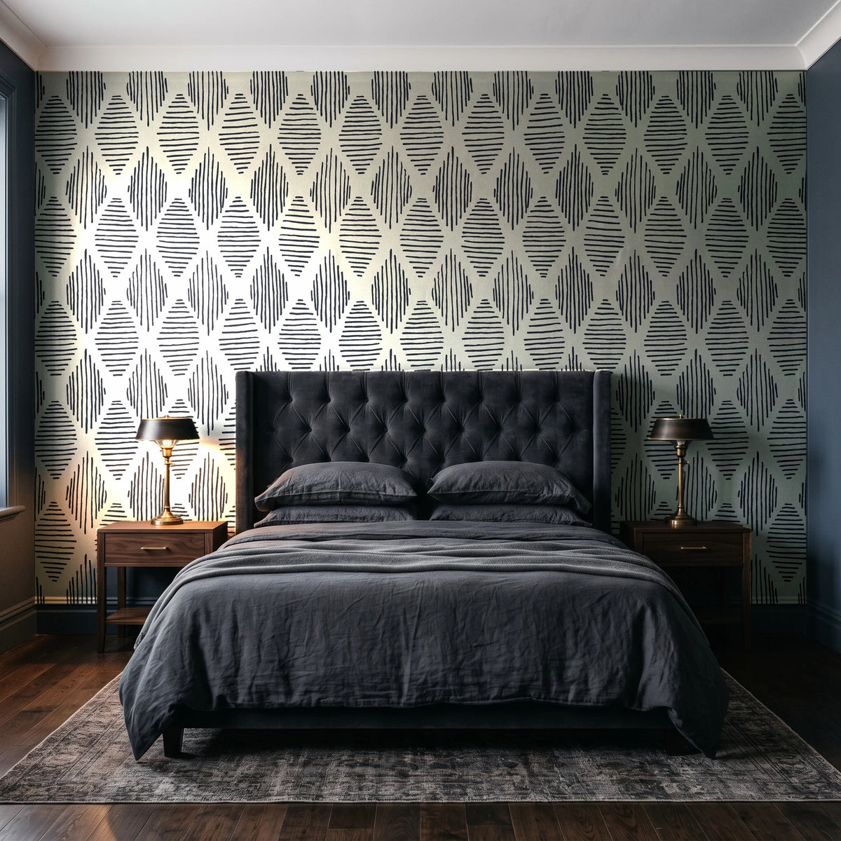 Reed & Smoke Ink geometric wallpaper behind a tufted headboard in a dark, moody bedroom
