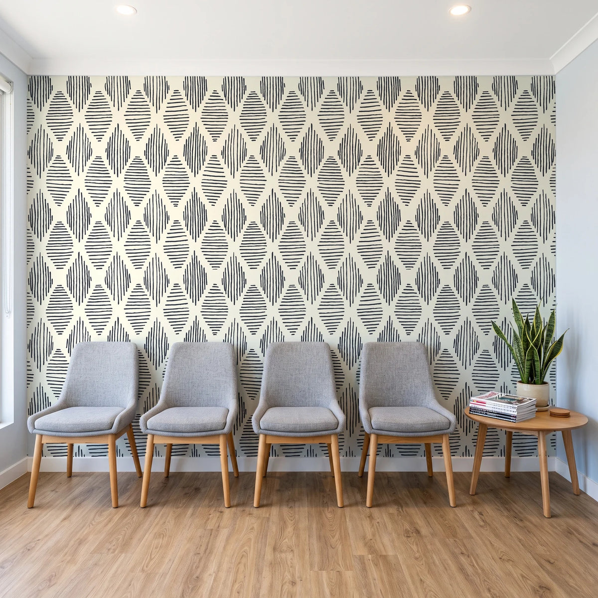 Reed & Smoke Ink geometric wallpaper behind a row of upholstered chairs in a bright clinic waiting room