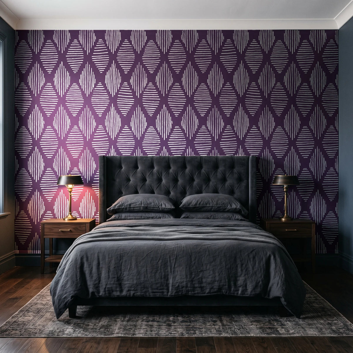 Reed & Smoke Plum geometric wallpaper behind a tufted headboard in a dark, moody bedroom