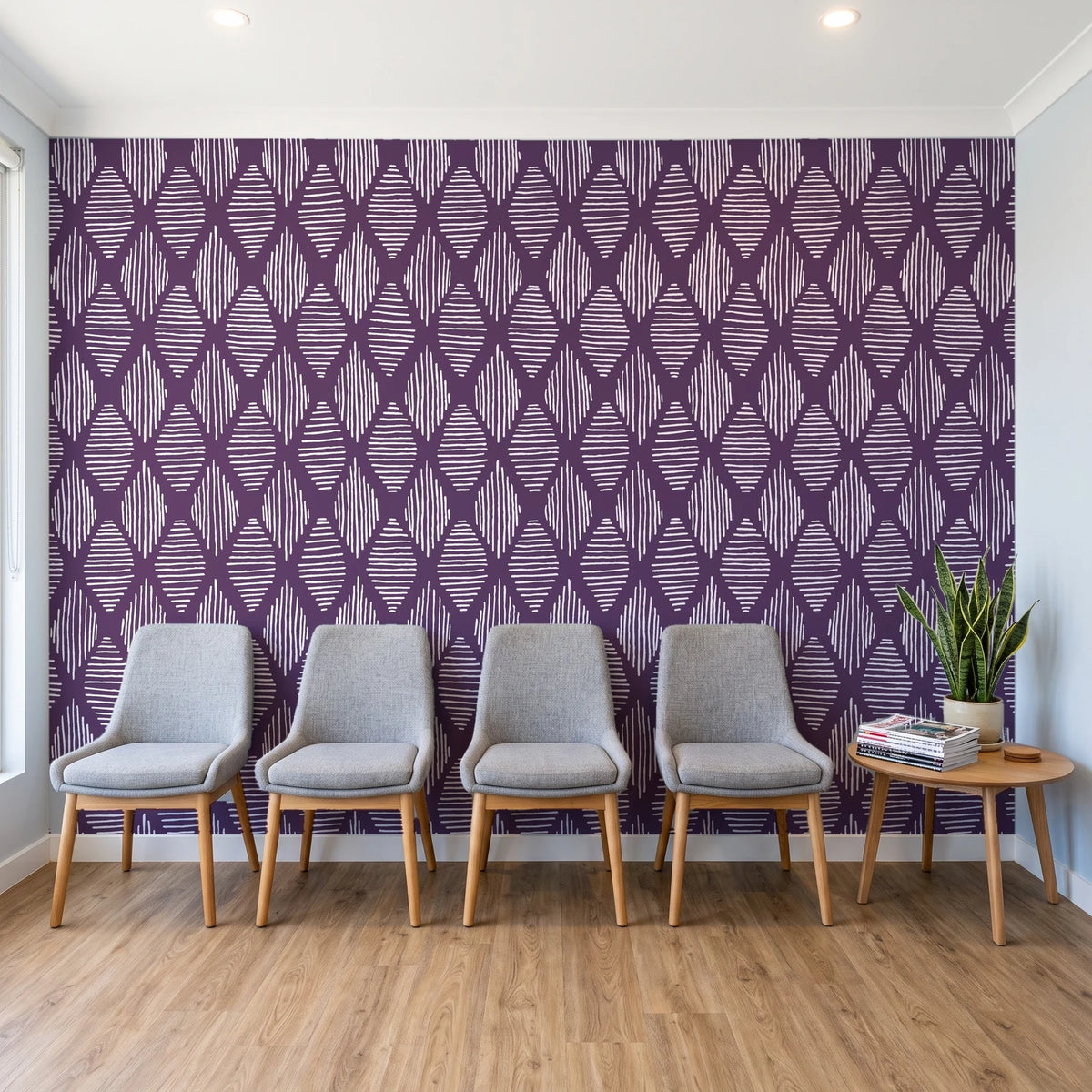 Reed & Smoke Plum geometric wallpaper behind a row of upholstered chairs in a bright clinic waiting room
