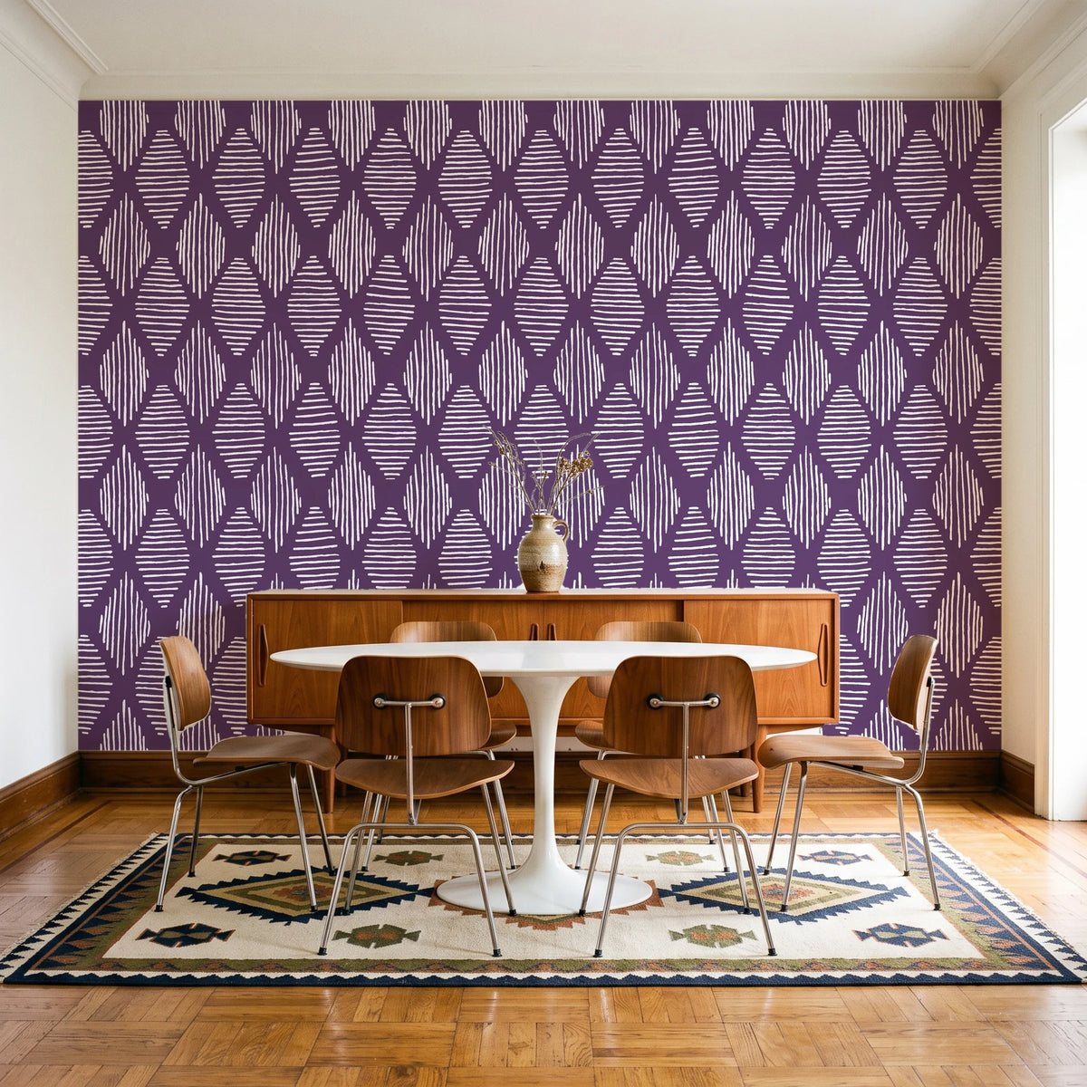 Reed & Smoke Plum geometric wallpaper in a mid-century dining room with a teak sideboard and tulip table