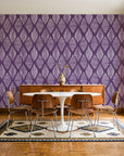 Reed & Smoke Plum geometric wallpaper in a mid-century dining room with a teak sideboard and tulip table