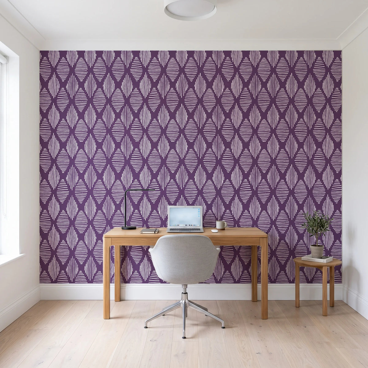 Reed & Smoke Plum geometric wallpaper behind a modern oak desk in a bright home office