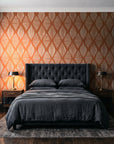 Reed & Smoke Terracotta geometric wallpaper behind a tufted headboard in a dark, moody bedroom