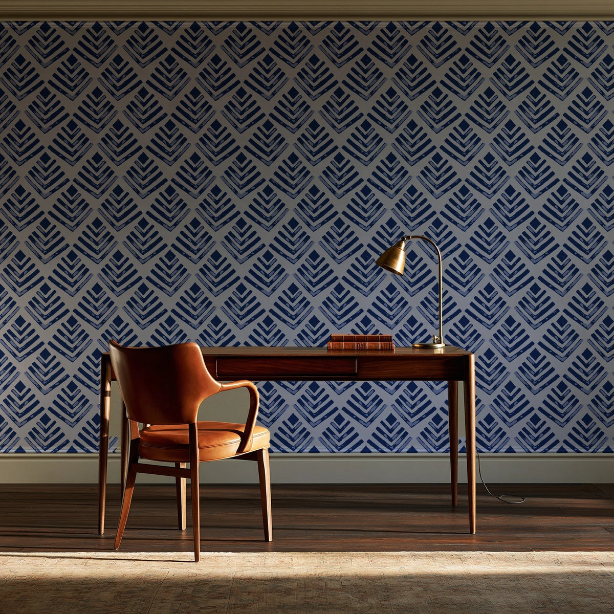 Rising Arrow Indigo geometric wallpaper as a feature wall in a home study