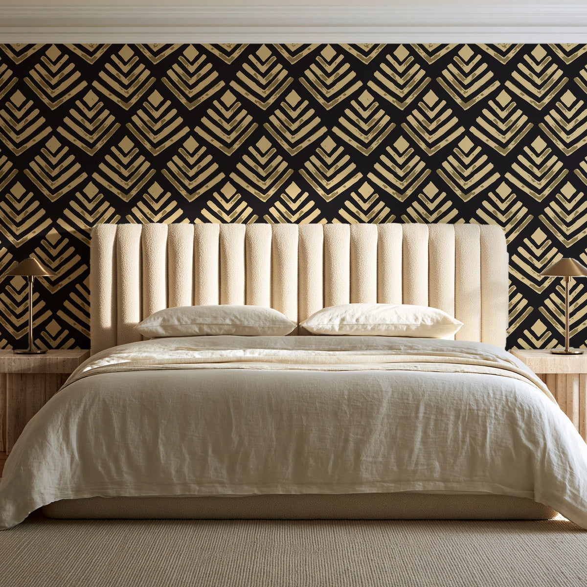 Rising Arrow Noir geometric wallpaper behind a channel-tufted bed in a calm primary bedroom