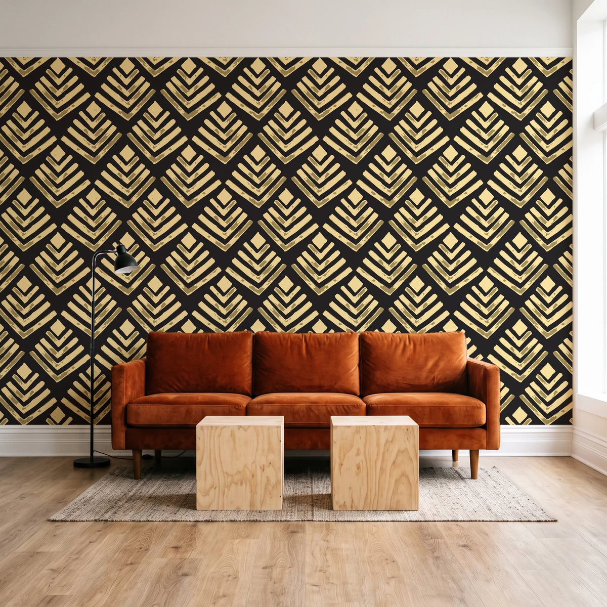 Rising Arrow Noir geometric wallpaper behind a rust velvet sofa in a bright coworking lounge