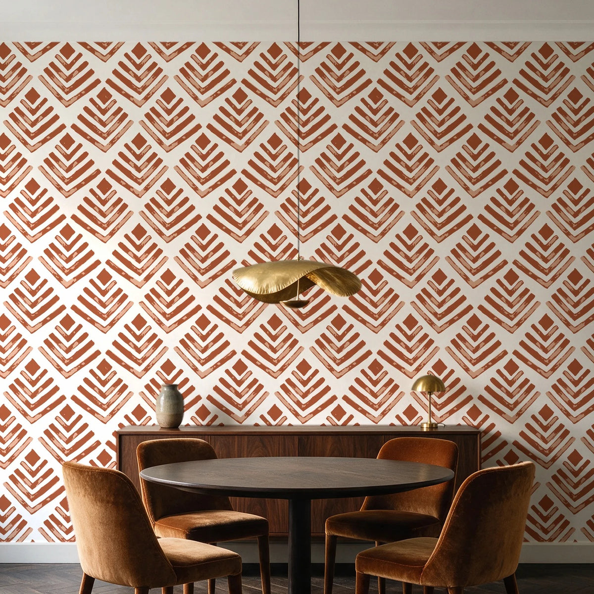 Rising Arrow Terracotta geometric wallpaper behind a walnut credenza and round table in an elegant dining room
