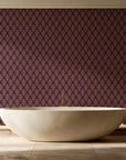 Rosewater Retreat Oxblood damask wallpaper creating ambiance in a serene spa bathroom