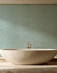 Sage Trellis Forest geometric wallpaper creating ambiance in a serene spa bathroom
