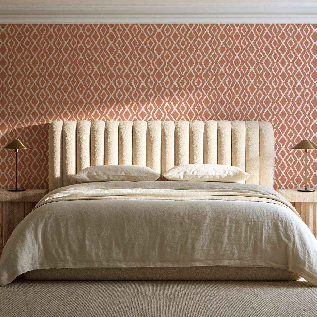 Sage Trellis Terracotta geometric wallpaper behind a channel-tufted bed in a calm primary bedroom