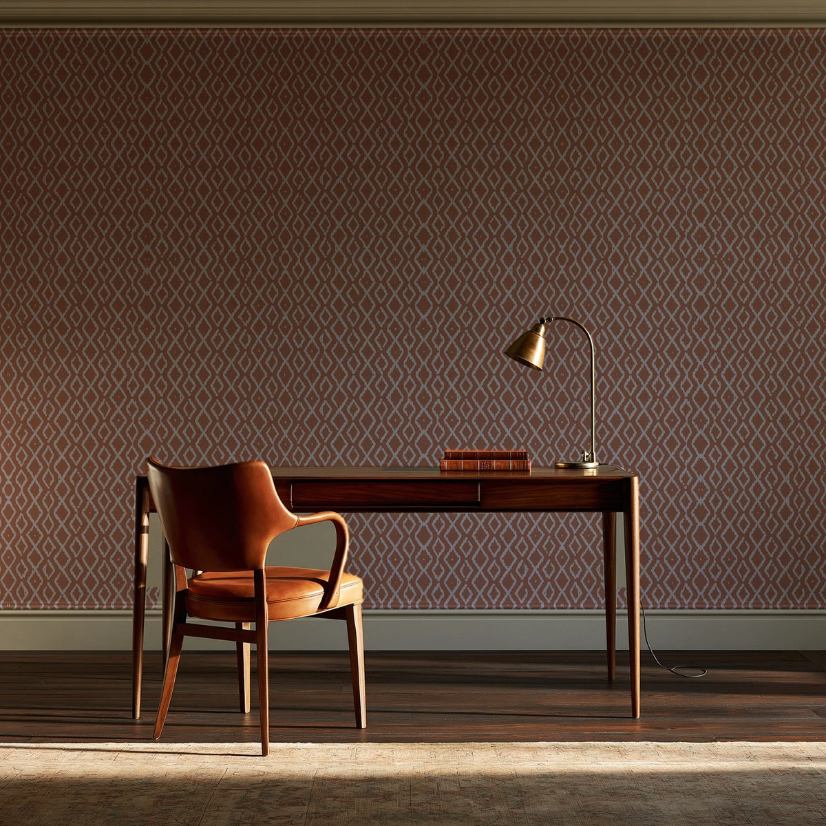Sage Trellis Terracotta geometric wallpaper as a feature wall in a home study
