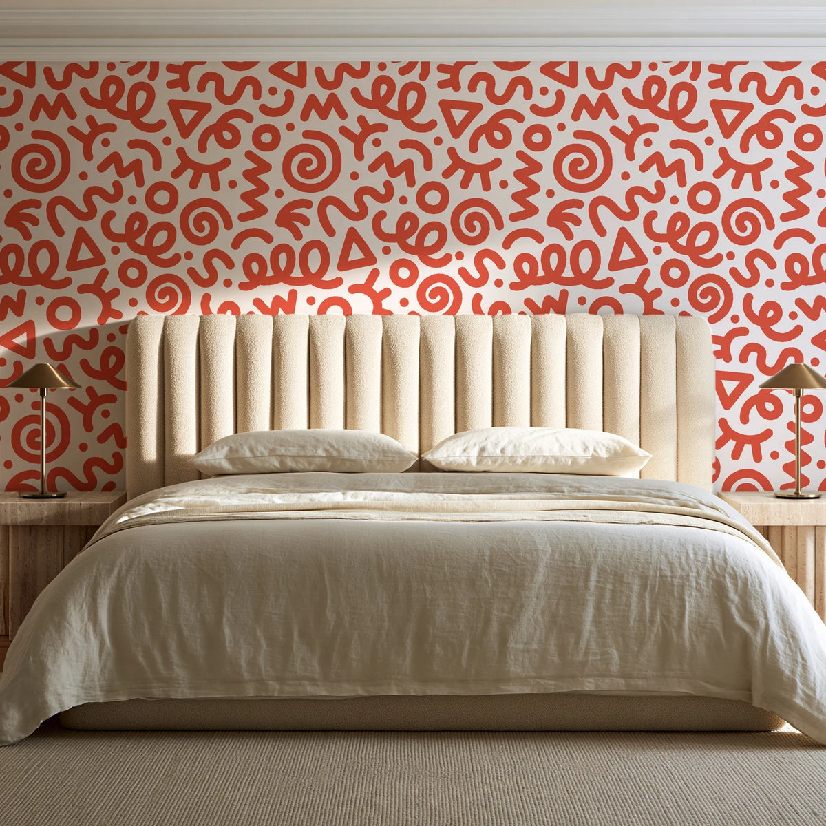 Scribble Pop Coral squiggle wallpaper behind a channel-tufted bed in a calm primary bedroom