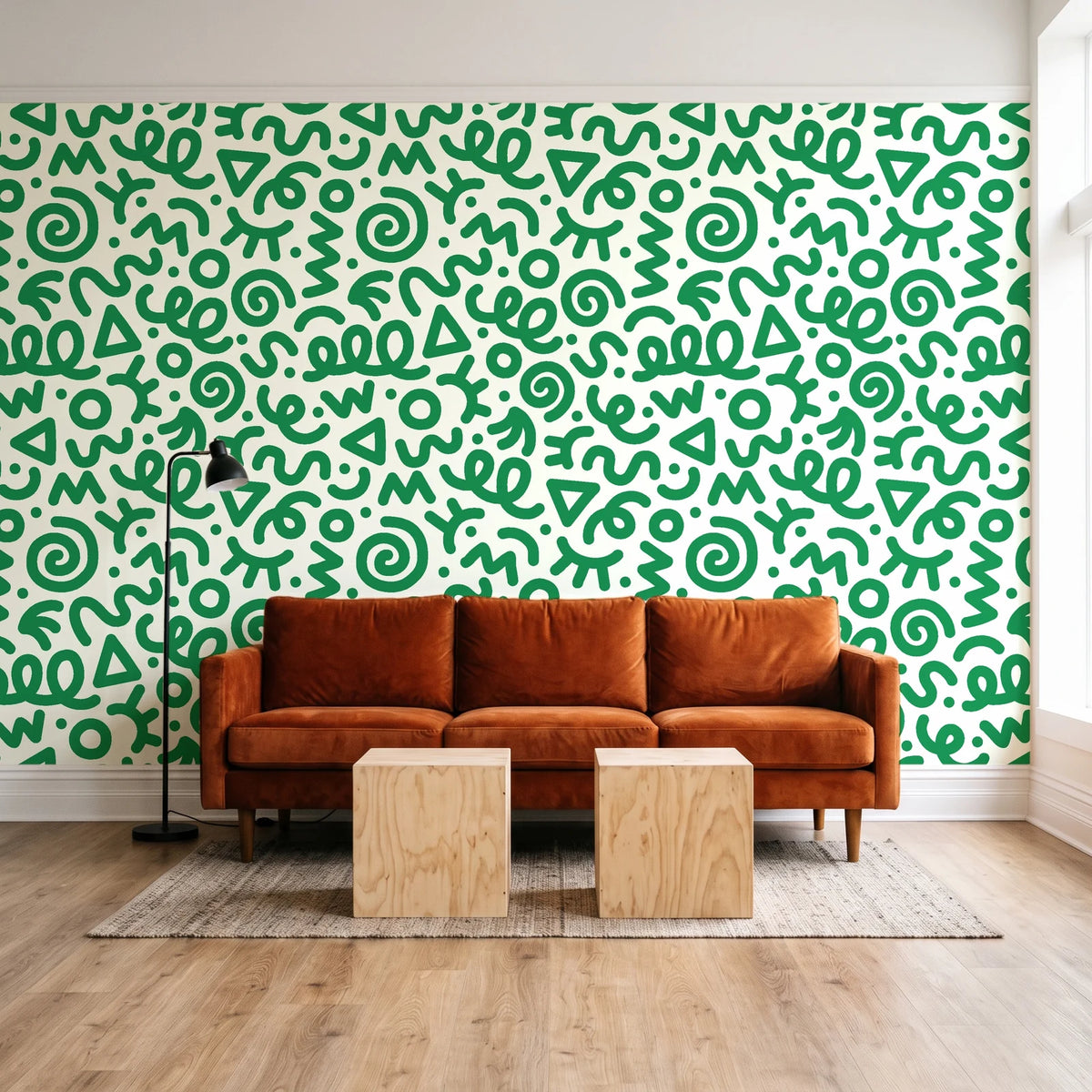 Scribble Pop Kelly Green squiggle wallpaper behind a rust velvet sofa in a bright coworking lounge