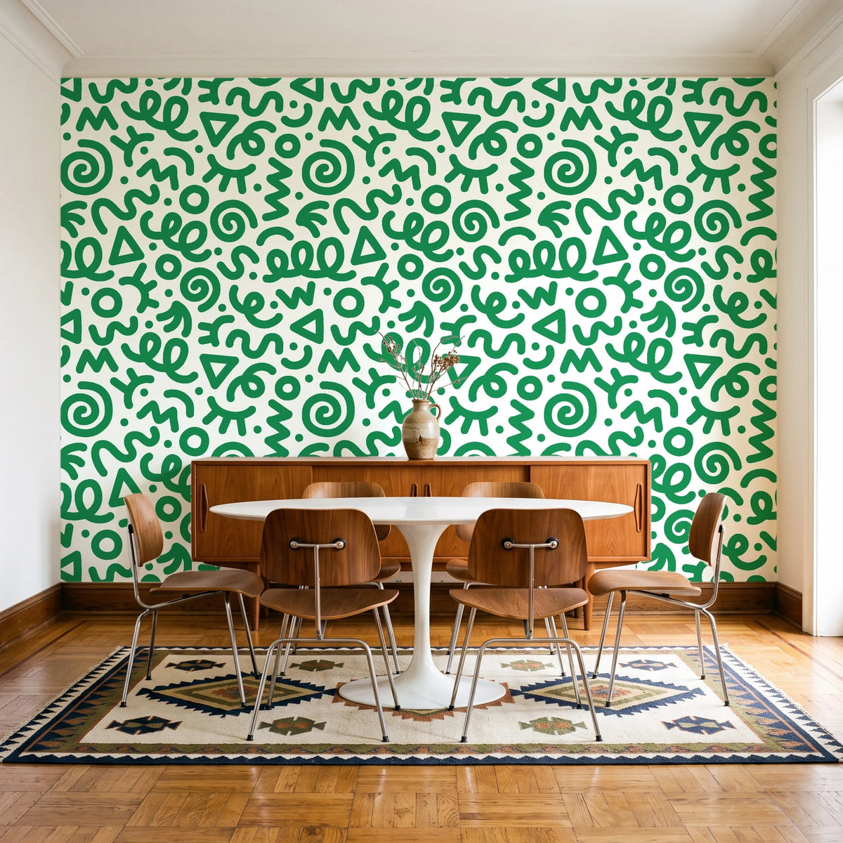 Scribble Pop Kelly Green squiggle wallpaper in a mid-century dining room with a teak sideboard and tulip table