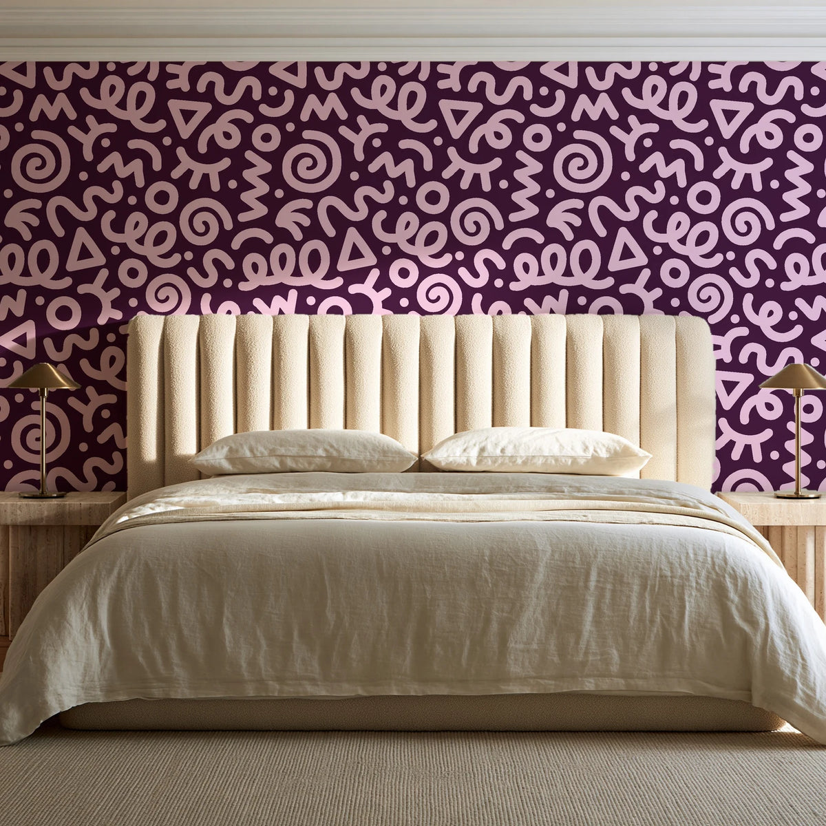 Scribble Pop Mulberry squiggle wallpaper behind a channel-tufted bed in a calm primary bedroom